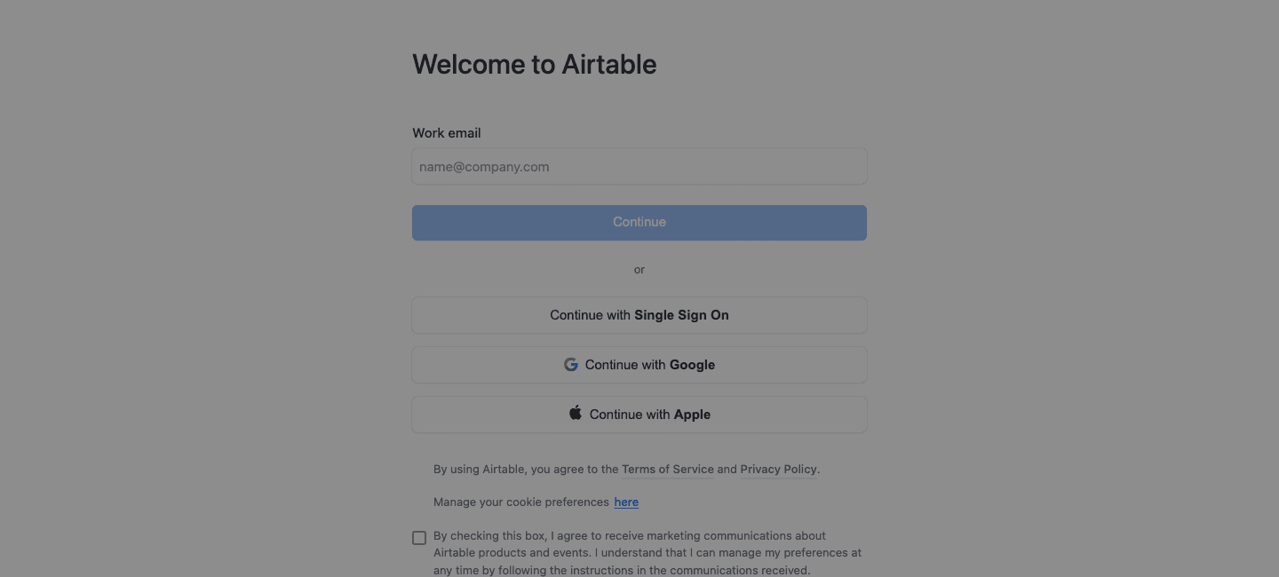 Airtable's signup entry screen: a single work-email field, SSO, Google, and Apple buttons, and a marketing-consent checkbox, with no plan selection or payment field in sight